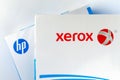 Reams of Xerox and HP brand A4 paper put on each other. Editorial illustrative photo for the Xerox takeover bid