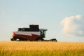 Reaping machine. Combine harvester in the field during the harvest. Royalty Free Stock Photo