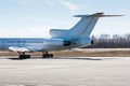 The rear of the airplane on the main taxiway Royalty Free Stock Photo