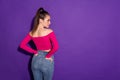 Rear back behind view portrait of attractive content slender girl posing copy space isolated on bright violet color Royalty Free Stock Photo