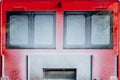 Rear back door window view covered with snow after blizzard snowfall of red modern snowcat ratrack grooming machine Royalty Free Stock Photo