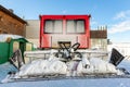 Rear back door window view covered with snow after blizzard snowfall of red modern snowcat ratrack grooming machine Royalty Free Stock Photo