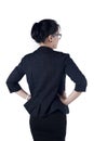 Rear / Back view of business woman standing.
