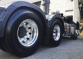 Rear of a Big Semi Truck Wheels Tires. Rubber. New Tyres with Chrome Wheels Royalty Free Stock Photo