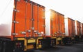 Rear of Containers Trailer Trucks Parking Lot. Safety Locked Shipping Container Door. Lorry. Industry Freight Trucks Logistics Royalty Free Stock Photo