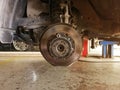 Rear disc brake in process of new tire replacement. Royalty Free Stock Photo