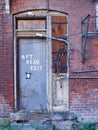 A rear door of and abandoned rooming house