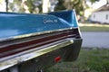 The rear end of a blue Chevrolet Electra.