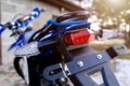 Rear end and brake light of enduro motorcycle close-up Royalty Free Stock Photo