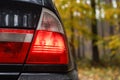 Rear end close up BMW E46 red car lights Royalty Free Stock Photo