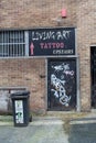 Rear entrance to Tattoo parlour with signage