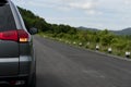 Rear of gray car with open turn light on new asphalt road. Royalty Free Stock Photo