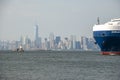 Rear of huge vessel in front of hazy Manhattan Skyline, New York City Royalty Free Stock Photo