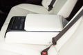 Rear leather passenger seats in modern lux car. Control unit with electric seat adjustment media system for rear
