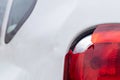 The rear left lamp of a white car is broken. The taillight of the car was shattered in the accident. Damage accident. Security Royalty Free Stock Photo