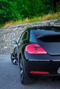 Rear left taillights and spoiler of coupe sport car Royalty Free Stock Photo