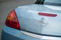 Rear light and logo on blue Opel Tigra parked in the street Royalty Free Stock Photo