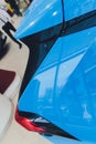 Rear light of a modern car close-up, white body. blue body Royalty Free Stock Photo