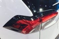 Rear light of a modern car close-up, white body. Royalty Free Stock Photo