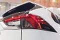 Rear light of a modern car close-up, white body. Royalty Free Stock Photo