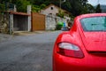 Rear light of a red Porsche Cayman 2.7 sport car, parked in a Royalty Free Stock Photo