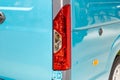 Rear lights on a blue minibus. Road safety