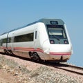 Rear of moving train on blue sky Royalty Free Stock Photo