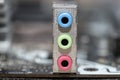 The rear panel of a desktop computer motherboard with visible audio mini jack connectors. Royalty Free Stock Photo