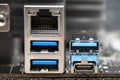 The rear panel of a desktop computer motherboard with visible connectors, USB and RJ45 network card. Royalty Free Stock Photo