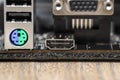 The rear panel of a desktop computer motherboard with visible connectors, USB, VGA, PS2 and HDMI. Royalty Free Stock Photo