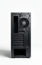 Rear panel of pc unit isolated on white. Computer case contains multiple slots. Device has fan for cooling system. Ports offer Royalty Free Stock Photo