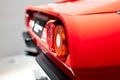 Rear part of Ferrari 208 GTB Turbo focused on round light