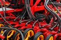 Rear part of modern Swedish pneumatic seed drill Vaderstad Spirit 400 C, with visible grain tubes, rakes, covering discs.