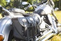 Rear part of motorcycle. Black leather bag.