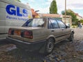 Rear part of veteran classic sedan car Toyota Corolla 1.8D parked