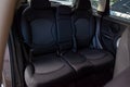 The rear passengers, after cleaning, clean the seats from black expensive fabric in the comfortable cabin of a crossover prepared Royalty Free Stock Photo