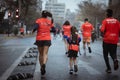 Rear of people during Gatorade running wearing orange suits in Santiago de Chile marathon