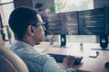 Rear photo of smart skilled young man worker qa engineer testing open data code typing keyboard looking computer Royalty Free Stock Photo