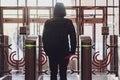 rear portrait of person go through security turnstile b Royalty Free Stock Photo