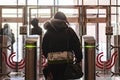 rear portrait of person go through security turnstile b Royalty Free Stock Photo