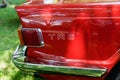 Rear quarter panel of a red Triumph TR6