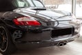 Rear quarter view of the 2006 sport porsche boxster s sedan prepared for sale and exhibited in the showroom with a polished shiny