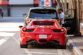 Rear of a red ferrari on the streets of Downtown Miami FL USA