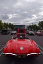 the rear of a red vintage car is parked on a lot Royalty Free Stock Photo