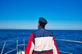 Rear sailor cap man sailing sea ocean in a boat Royalty Free Stock Photo