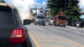 Rear side of black car driving on the asphalt road in the city. Royalty Free Stock Photo