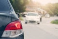 Rear side of black car stop and turn brake light. on the asphalt road. Royalty Free Stock Photo