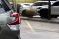 Rear side of car with turn on tail light in parking lot. Royalty Free Stock Photo