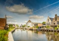 Rear side homes on waterfront the Drecht against blue sky with clouds Royalty Free Stock Photo