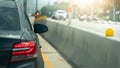 Rear side view of black car with turn on brake light. Royalty Free Stock Photo